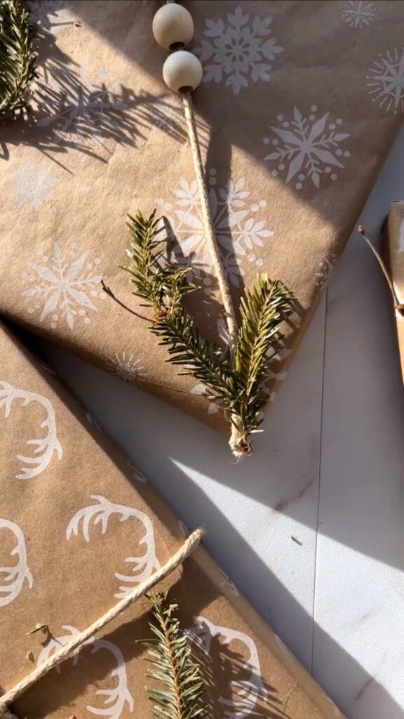 Neutral holiday decor and wrapping paper with repurposed tree trimmings
